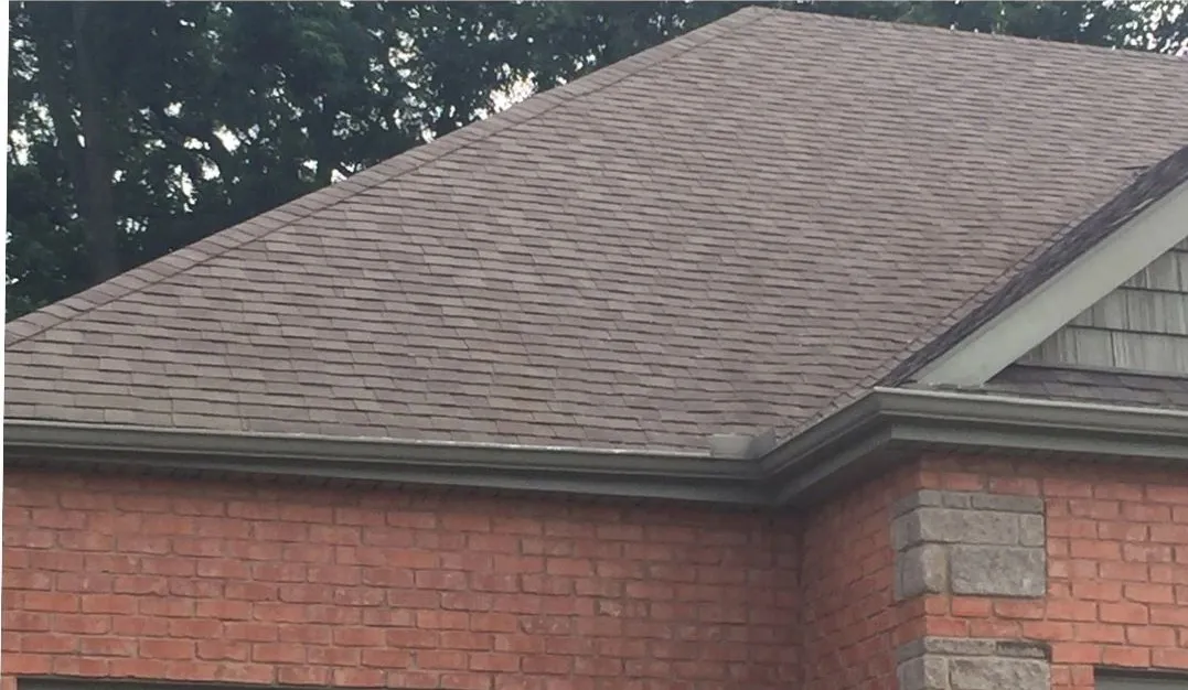 Shingle roof over brick after cleaning
