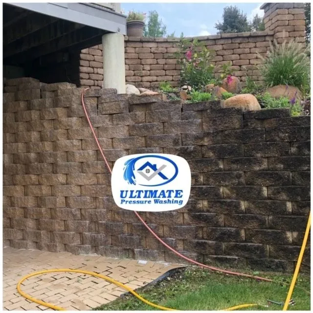 Block retaining wall partway through cleaning